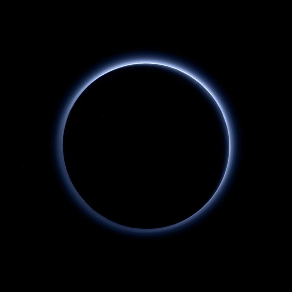 NASA New Horizon Image of Pluto Shows a blue haze surrounding the planet