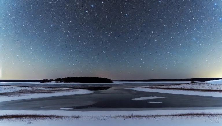 bright stars shine over a winter landscape. there is a lake, snow, and an island